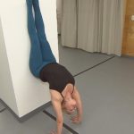the basics of yoga how to perform a hollow handstand