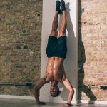 the basics of yoga how to perform a hollow handstand 2