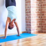 the basics of yoga how to perform a hollow handstand 3