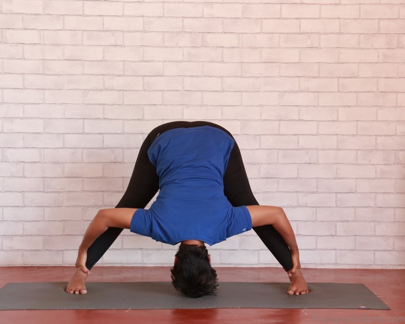 the power and elegance of the wide legged forward bend ii yoga pose 4